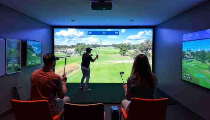 Players testing golf simulator software together in an indoor golf room